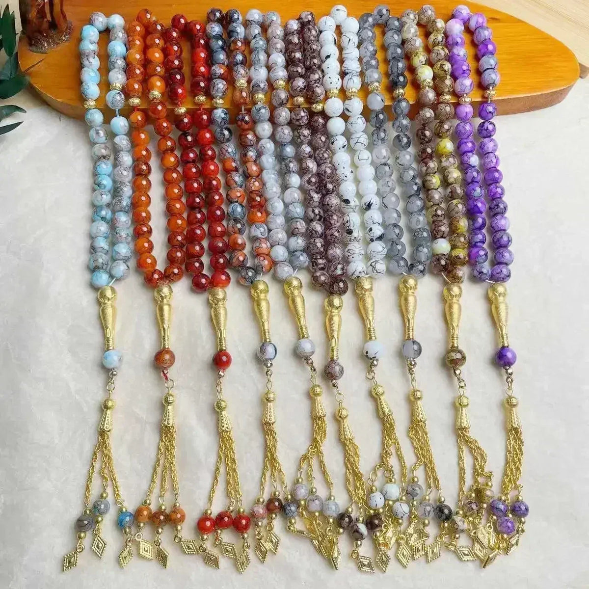Tasbih med glasperler — 33 perler og guldkvast