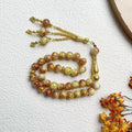 Tasbih med glasperler — 33 perler og guldkvast